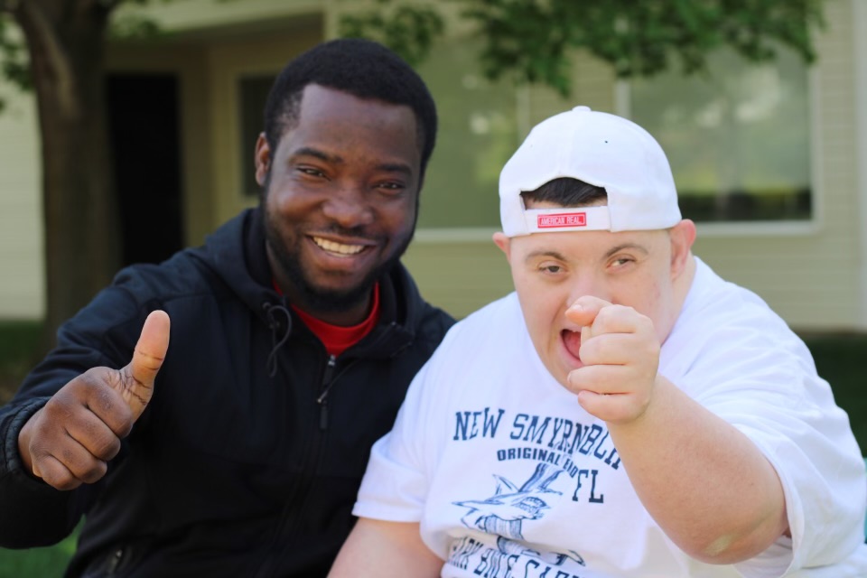A UnionCare caregiver supporting a participant outdoors